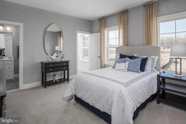 a bedroom with bed and a dresser