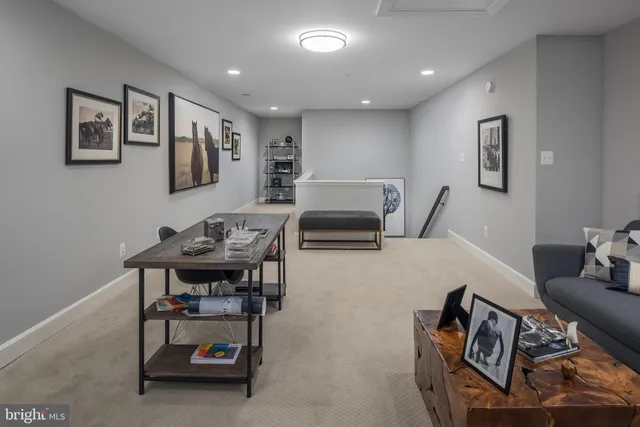 a living room with furniture and air hockey table