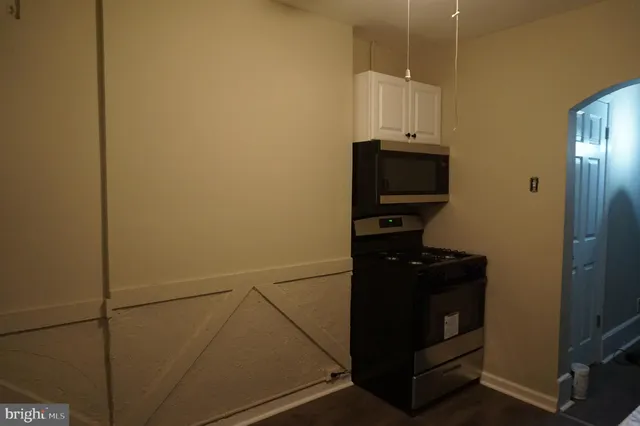 a view of a storage and utility room with washer and dryer