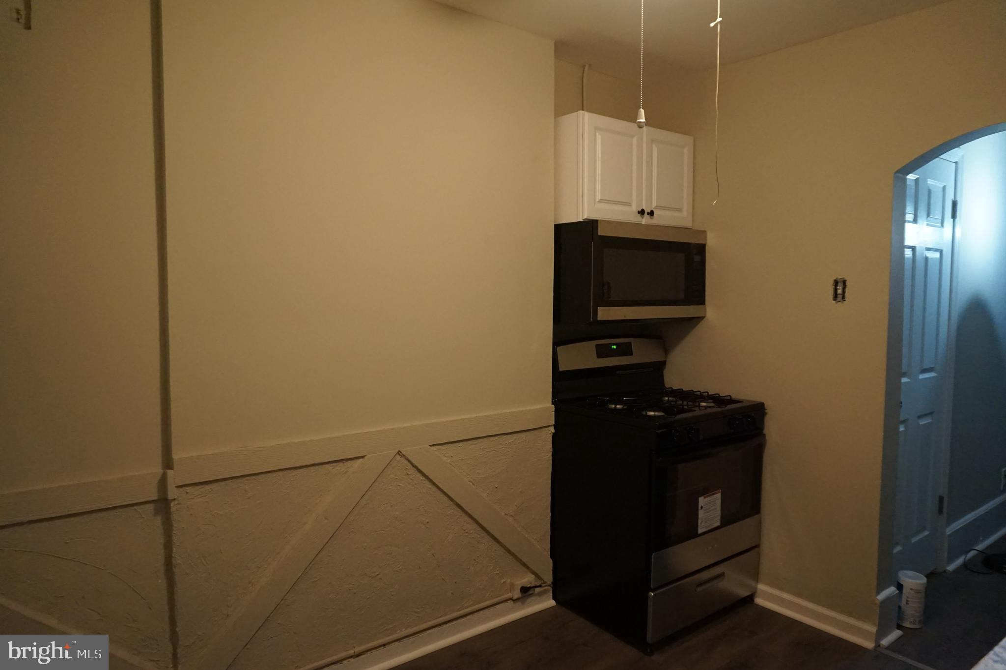 235 Cleveland Street Bristol, PA 19007 - Photo 7 of 18 a view of a storage and utility room with washer and dryer
