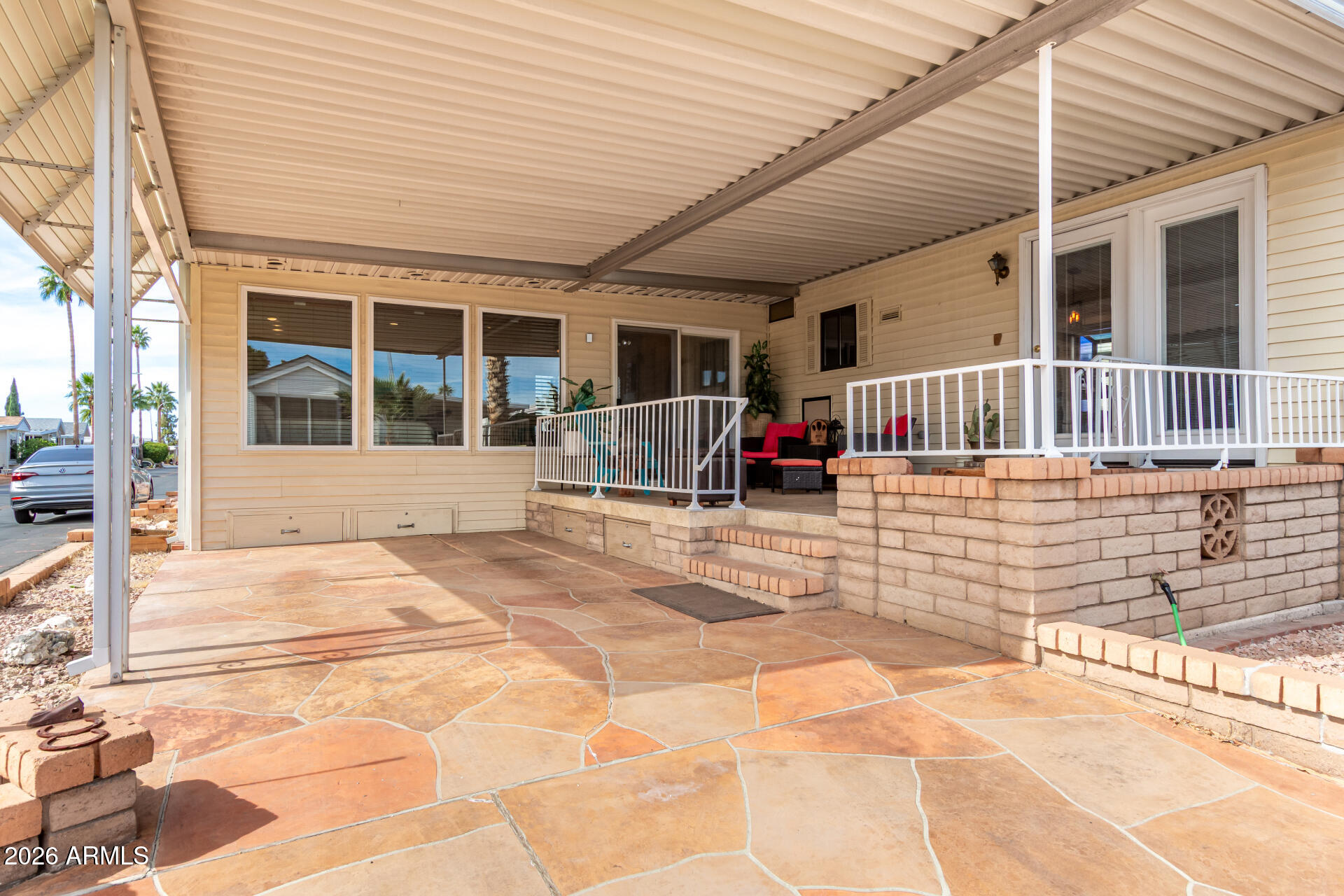 111 South Greenfield Road, Unit 547 Mesa, AZ 85206 - Photo 4 of 38 a front view of a house with a patio
