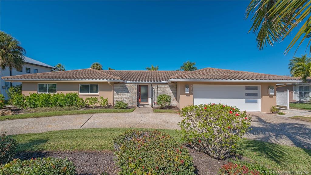 513 Gunwale Lane Longboat Key, FL 34228 - Photo 1 of 61 front view of a house with a yard