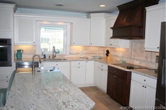 513 Gunwale Lane Longboat Key, FL 34228 - Photo 12 of 61 a kitchen with a sink stove and cabinets
