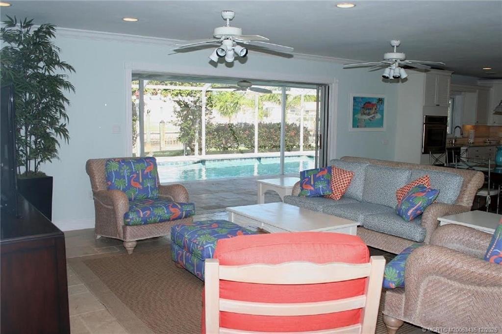 513 Gunwale Lane Longboat Key, FL 34228 - Photo 12 of 59 a living room with furniture and a large window