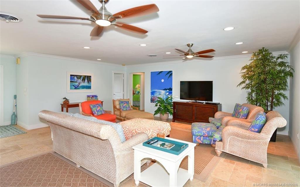 513 Gunwale Lane Longboat Key, FL 34228 - Photo 13 of 61 a living room with furniture a flat screen tv and a potted plant