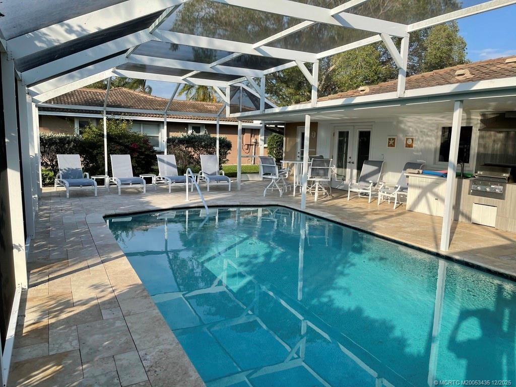513 Gunwale Lane Longboat Key, FL 34228 - Photo 16 of 59 a view of a swimming pool with outdoor seating