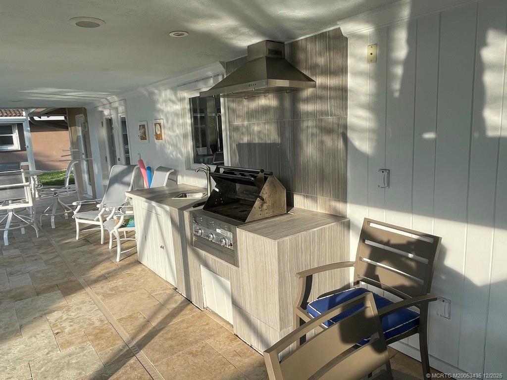 513 Gunwale Lane Longboat Key, FL 34228 - Photo 19 of 59 a kitchen with a stove and a refrigerator