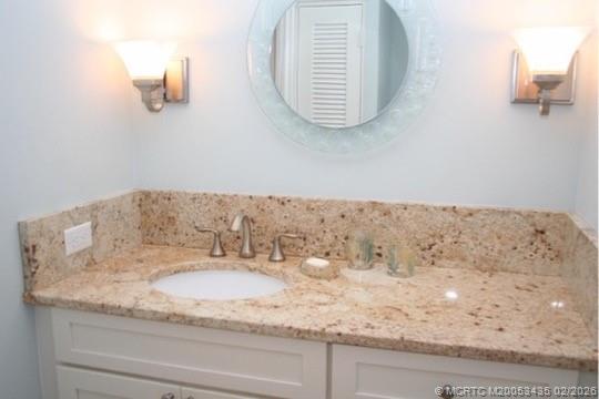 513 Gunwale Lane Longboat Key, FL 34228 - Photo 26 of 61 a bathroom with a granite countertop sink and vanity