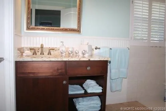 a bedroom with a bed and a lamp