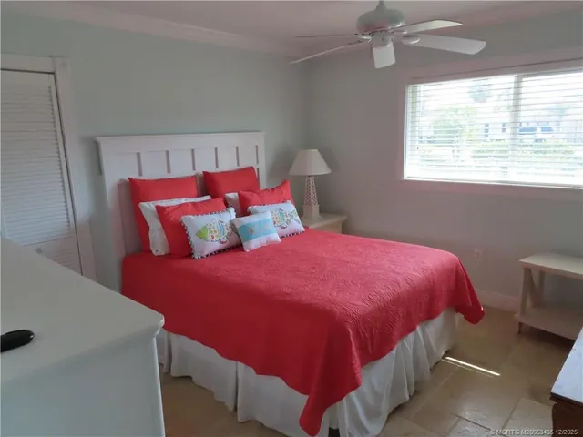 a bedroom with a bed and a table in it