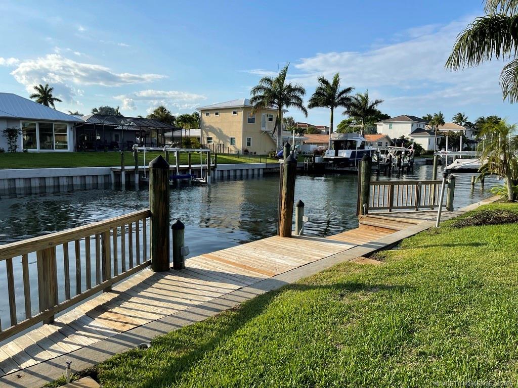 513 Gunwale Lane Longboat Key, FL 34228 - Photo 46 of 59 a view of a lake with boats and palm trees