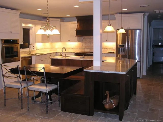 a view of a backyard with a table and chairs with wooden floor