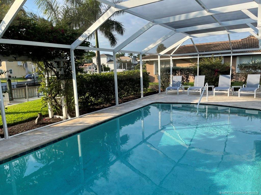 513 Gunwale Lane Longboat Key, FL 34228 - Photo 57 of 61 a view of a swimming pool with a patio