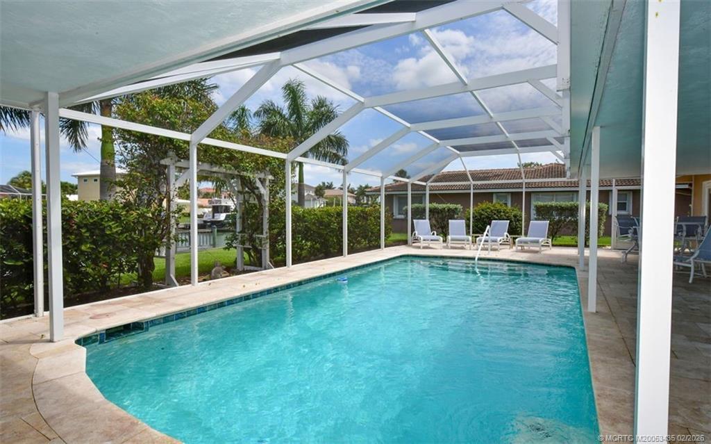 513 Gunwale Lane Longboat Key, FL 34228 - Photo 59 of 61 a view of outdoor space with swimming pool in front of it