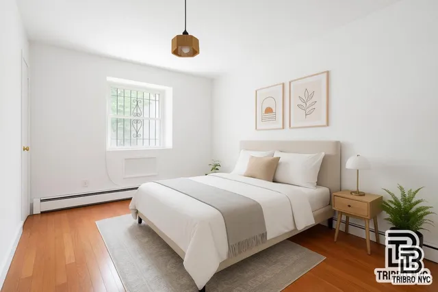 a bedroom with bed and a window