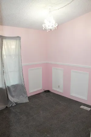 a view of an empty room with window