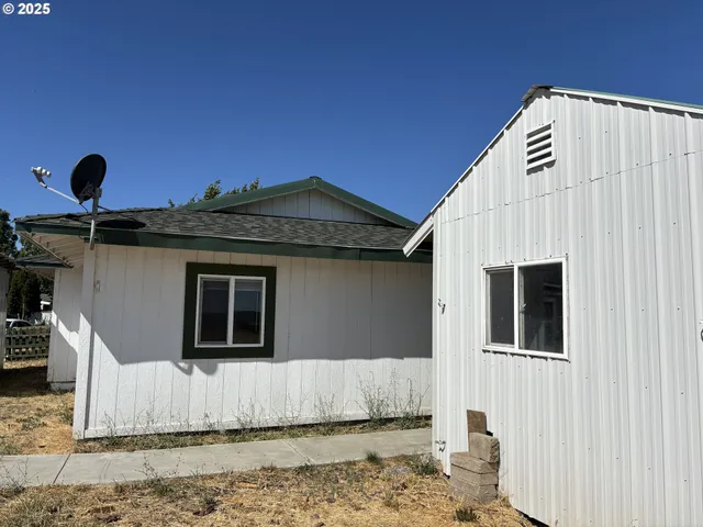 a house view with a backyard space