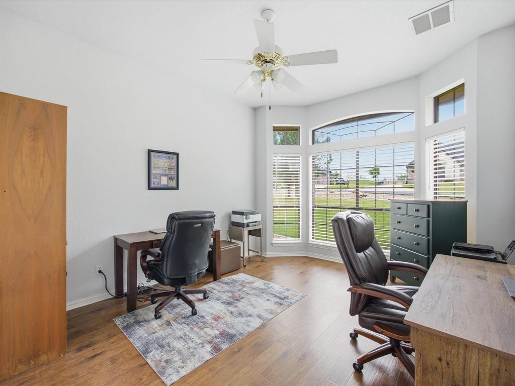 10106 Ravenswood Road Granbury, TX 76049 - Photo 16 of 39 a work room with furniture and a window
