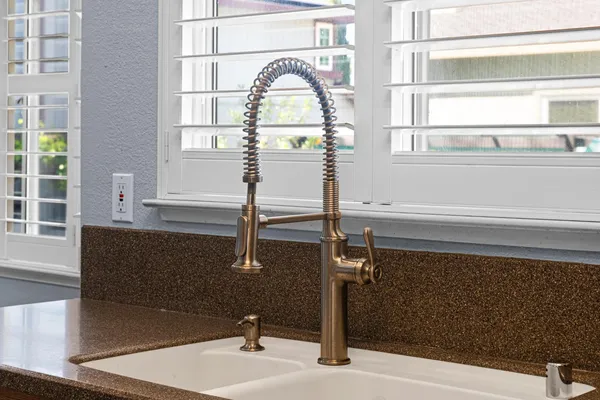 a bathroom with a sink and a window