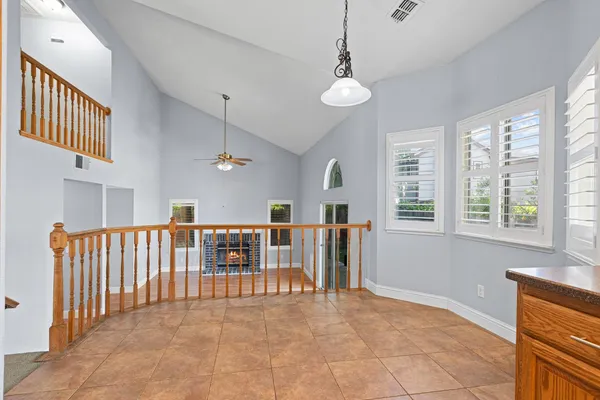 a view of a livingroom with furniture and staircase