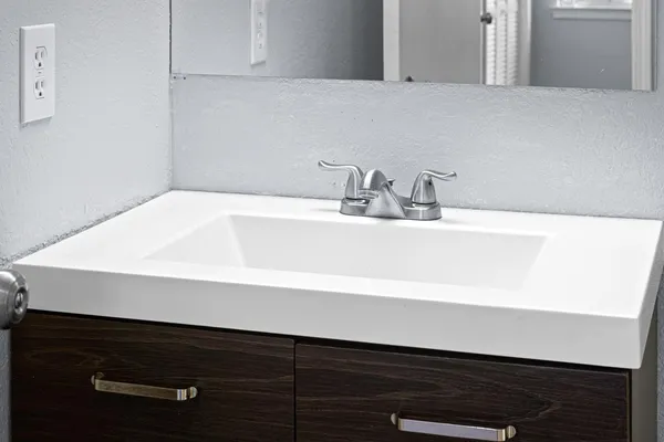 a bathroom with a sink and a vanity