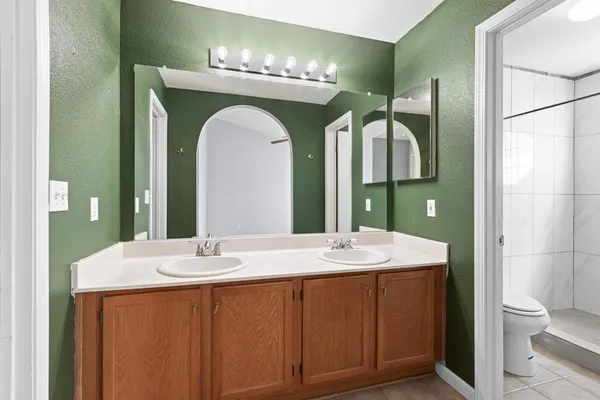a bathroom with a shower and a toilet