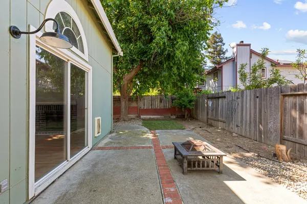 a view of a backyard with a patio