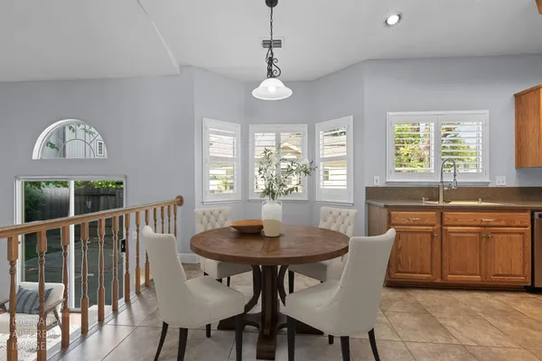 a view of a dining room with furniture window and outside view