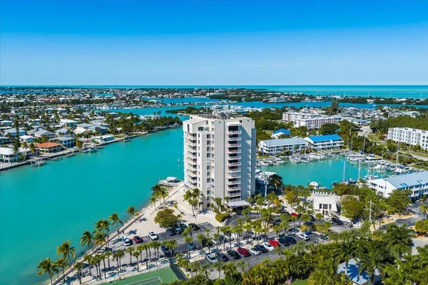an aerial view of a city with a lake view