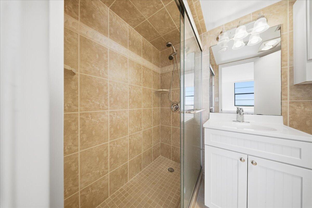 2000 Coco Plum Drive, Unit 601 Marathon, FL 33050 - Photo 22 of 45 a bathroom with a shower and a sink