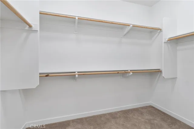 a view of a room with shelf on the wall
