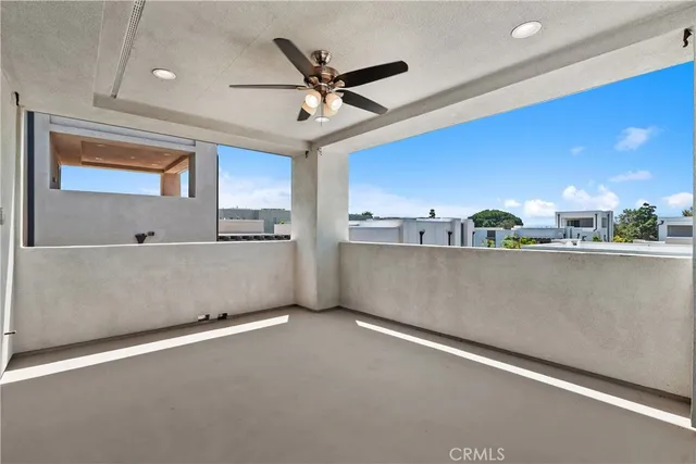 a view of a kitchen with a sink and a ceiling fan