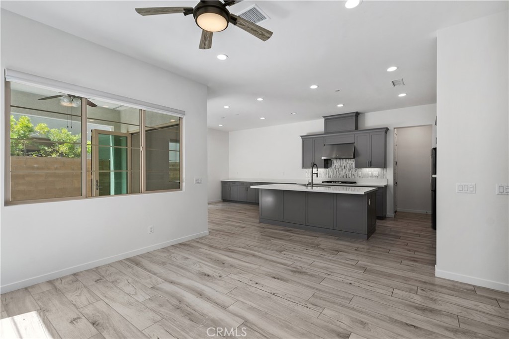 112 Menkar Irvine, CA 92618 - Photo 3 of 54 a large white kitchen with kitchen island a island in the center