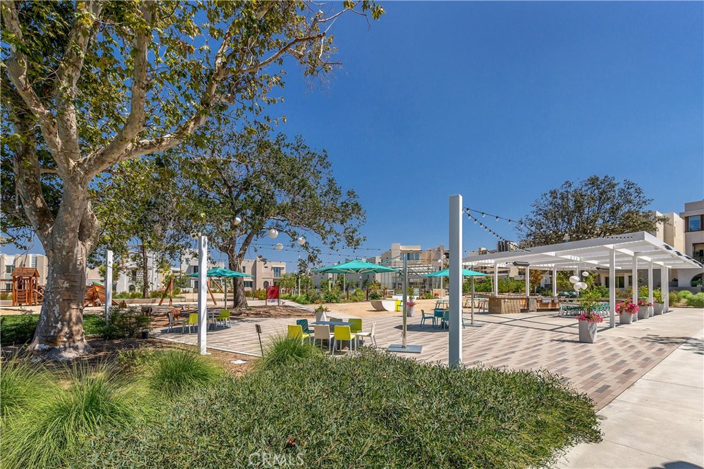 112 Menkar Irvine, CA 92618 - Photo 43 of 54 a view of patio with a table and chairs under an umbrella