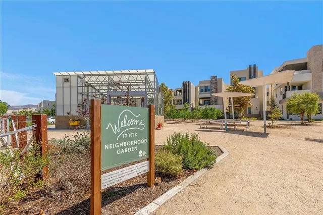 a view of a park with swings and slides