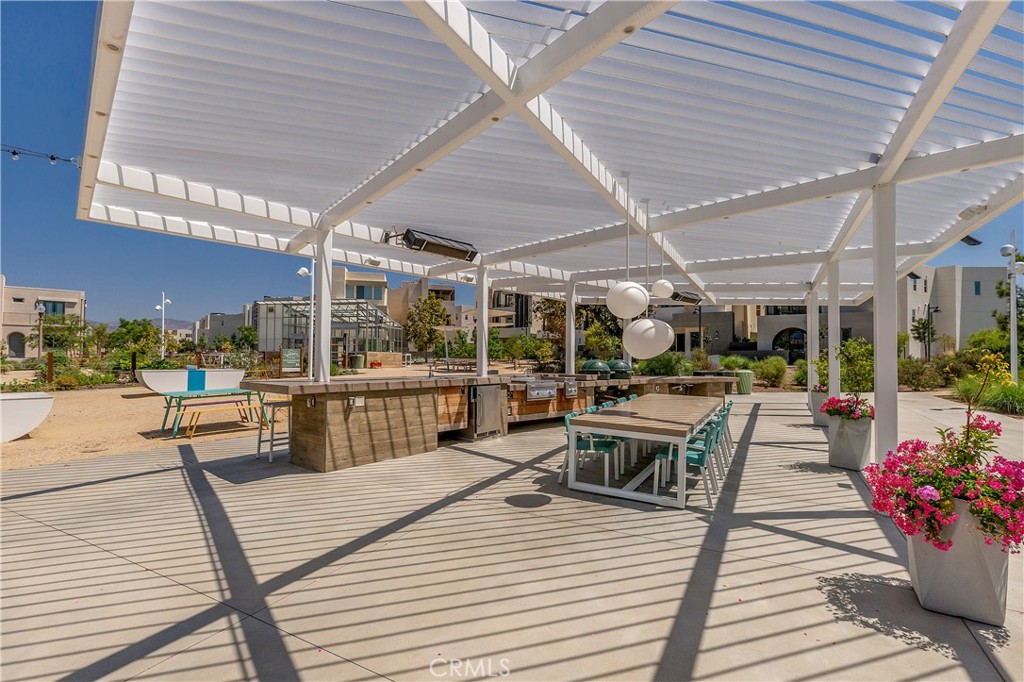 112 Menkar Irvine, CA 92618 - Photo 50 of 54 a view of a patio with dining table and chairs