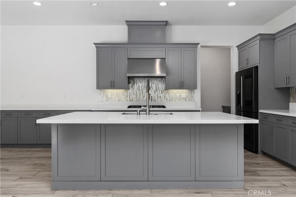 112 Menkar Irvine, CA 92618 - Photo 7 of 54 a kitchen with a sink stainless steel appliances and cabinets