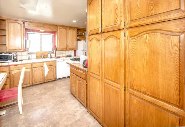 a kitchen with a stove and a refrigerator
