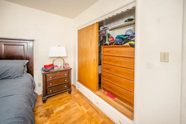 a spacious bedroom with a large bed and a window