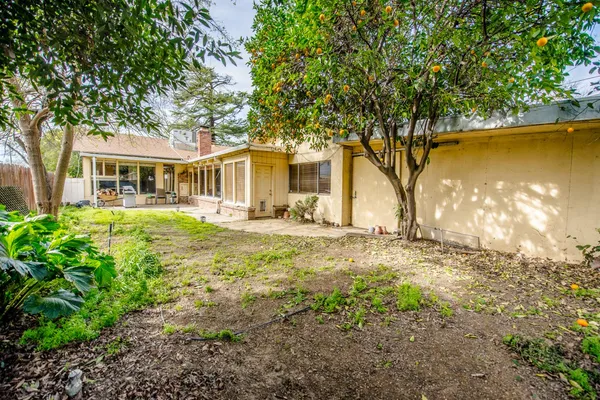 a view of a livingroom with furniture and a yard