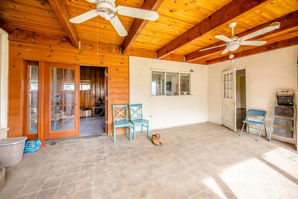 a view of a house with sitting area and garden