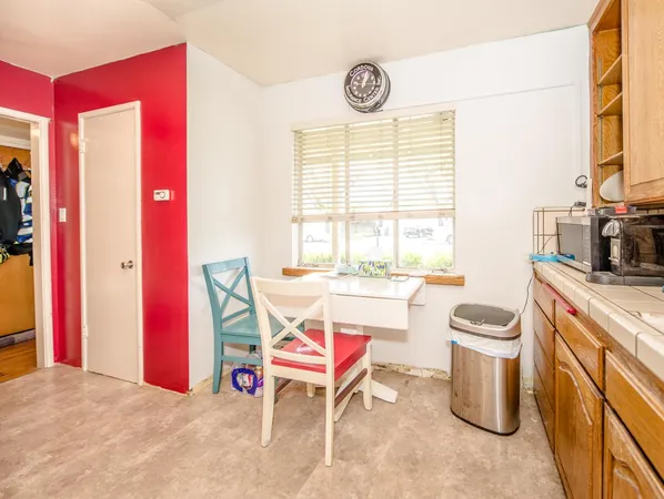 a living room with a stove and a table
