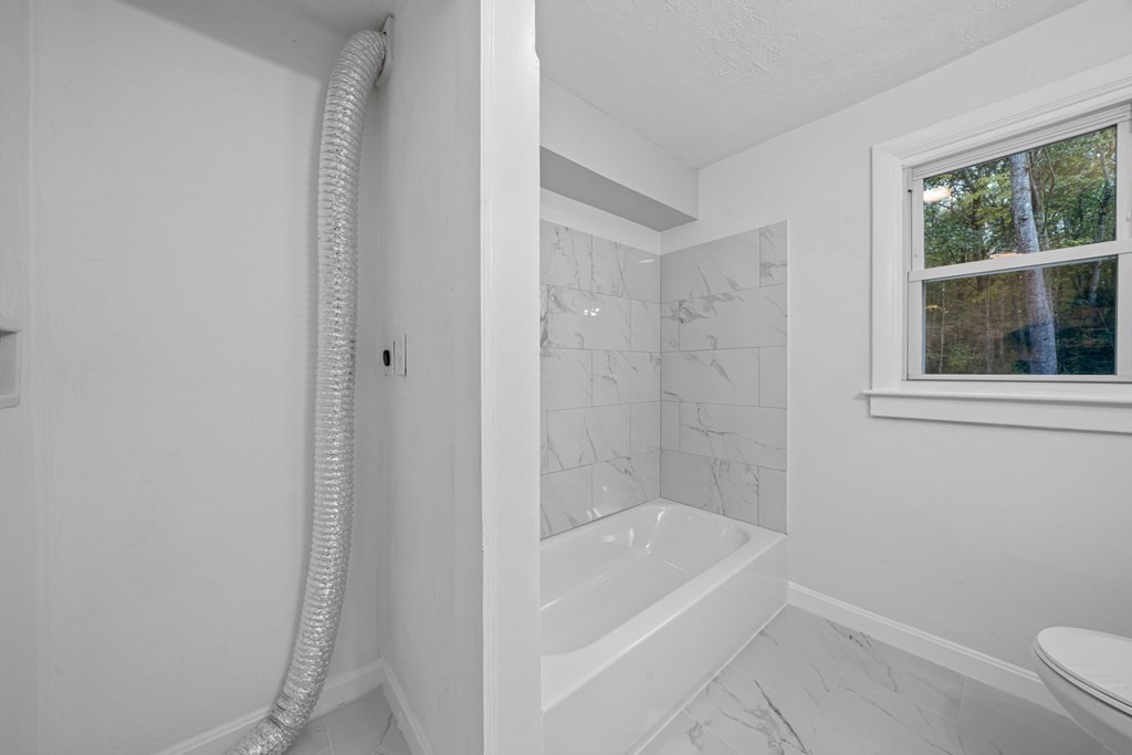 6 Ralph Road Princeton, MA 01541 - Photo 8 of 33 a white bath tub sitting next to a shower