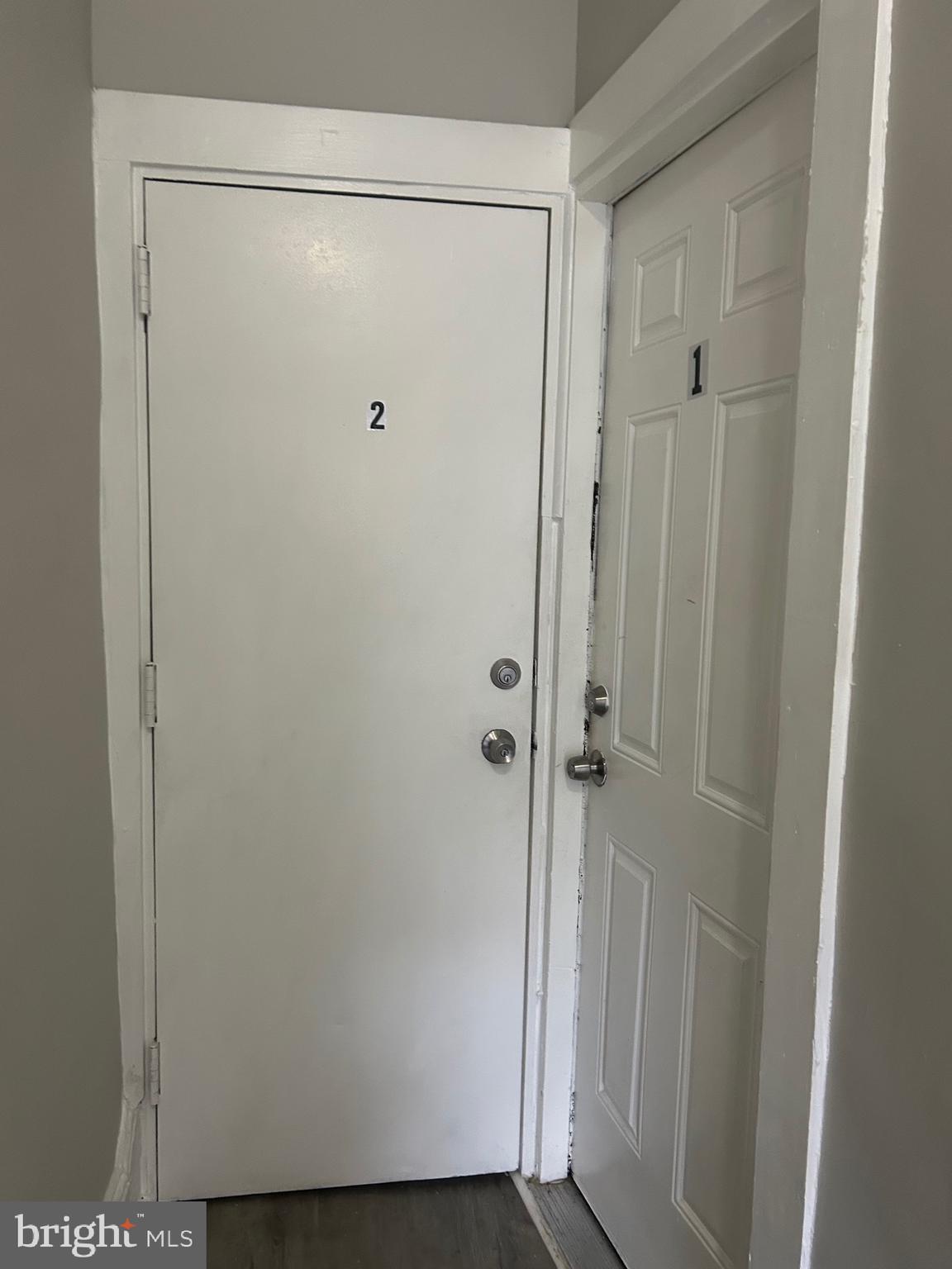 1503 East 28th Street, Unit 2 Baltimore, MD 21218 - Photo 3 of 9 a bathroom with a glass shower door