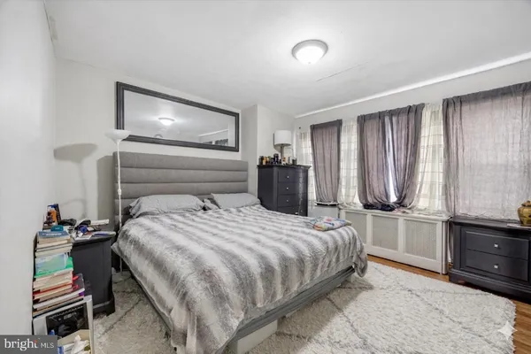a bedroom with a bed and a closet