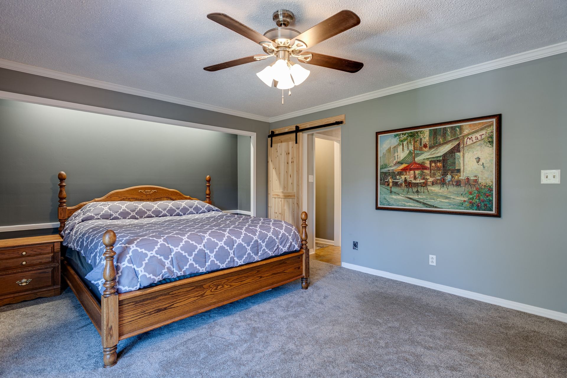 2743 Mouse Tail Road Parsons, TN 38363 - Photo 16 of 79 a bedroom with a bed and a chandelier