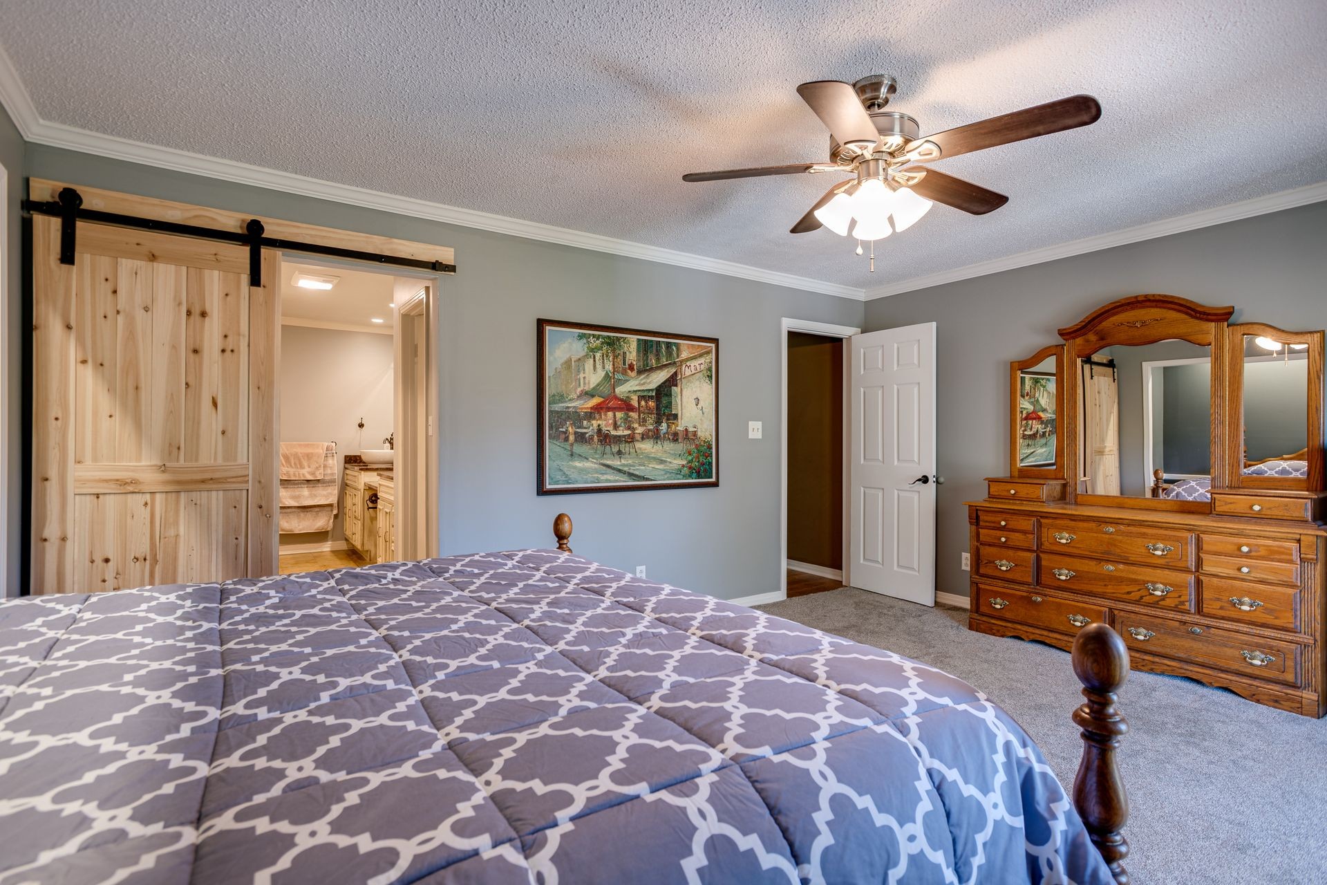 2743 Mouse Tail Road Parsons, TN 38363 - Photo 17 of 79 a bedroom with a bed and a chandelier