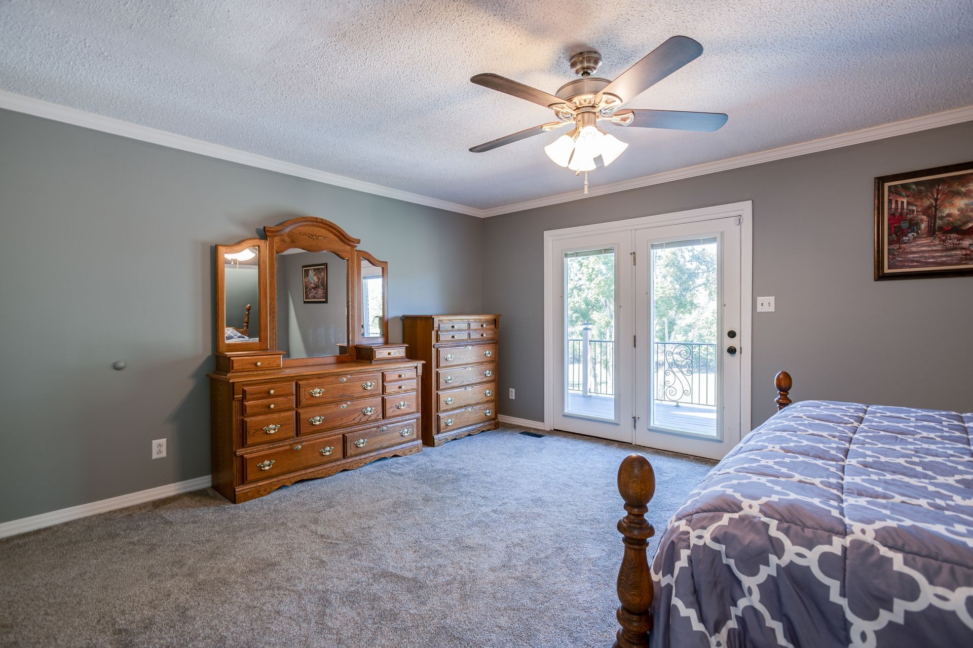 2743 Mouse Tail Road Parsons, TN 38363 - Photo 18 of 79 a bedroom with a bed and a chandelier