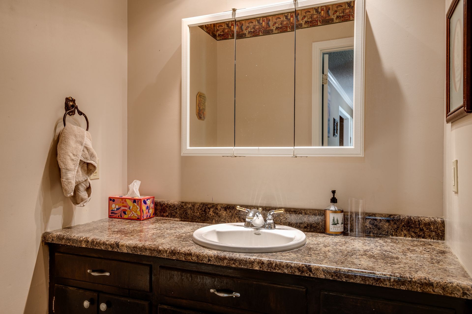 2743 Mouse Tail Road Parsons, TN 38363 - Photo 23 of 79 a bathroom with a granite countertop sink and a mirror