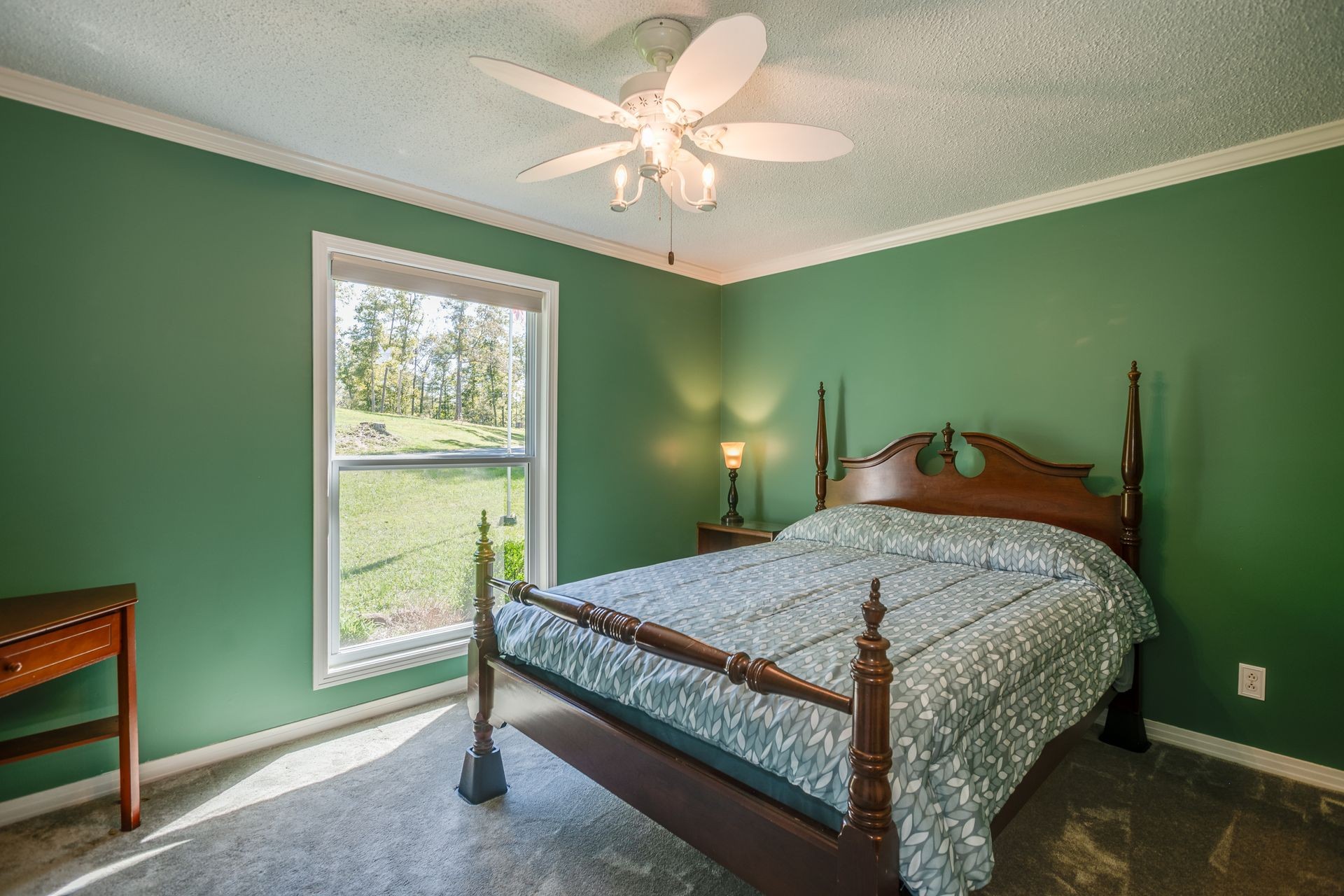 2743 Mouse Tail Road Parsons, TN 38363 - Photo 27 of 79 a bedroom with a bed and a chandelier fan